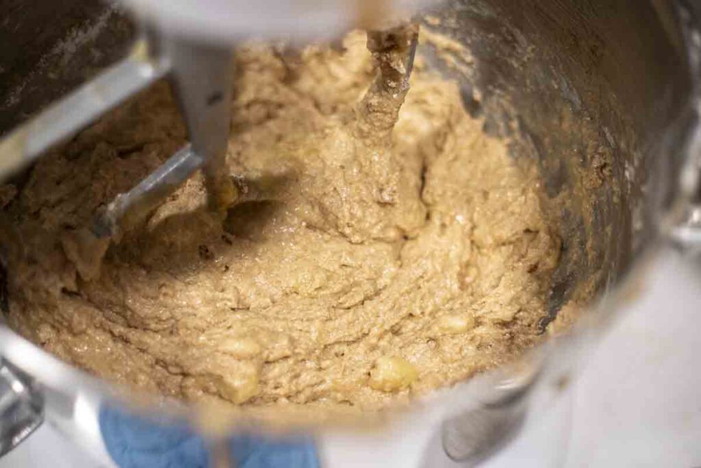 sourdough banana bread batter mixed together in a stand mixer.
